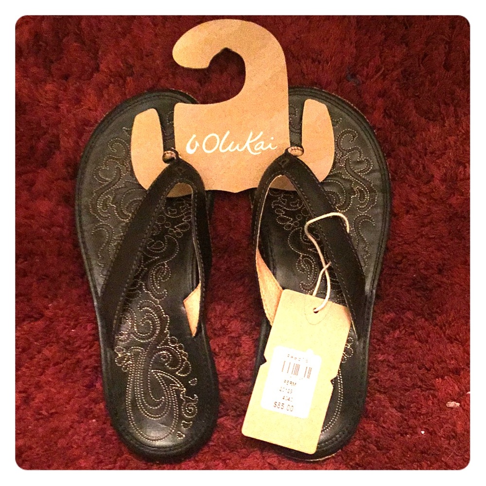 Olukai black leather flip flops